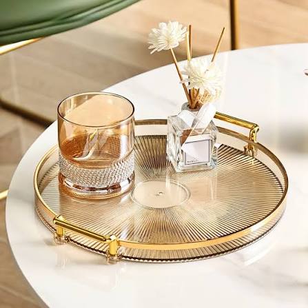 Add elegance to your home with a stylish glass tray decor setup. Pair decorative candles, reed diffusers, and modern accessories on a gold-rimmed glass tray to create a sophisticated centerpiece for your coffee table, dining table, or living room.